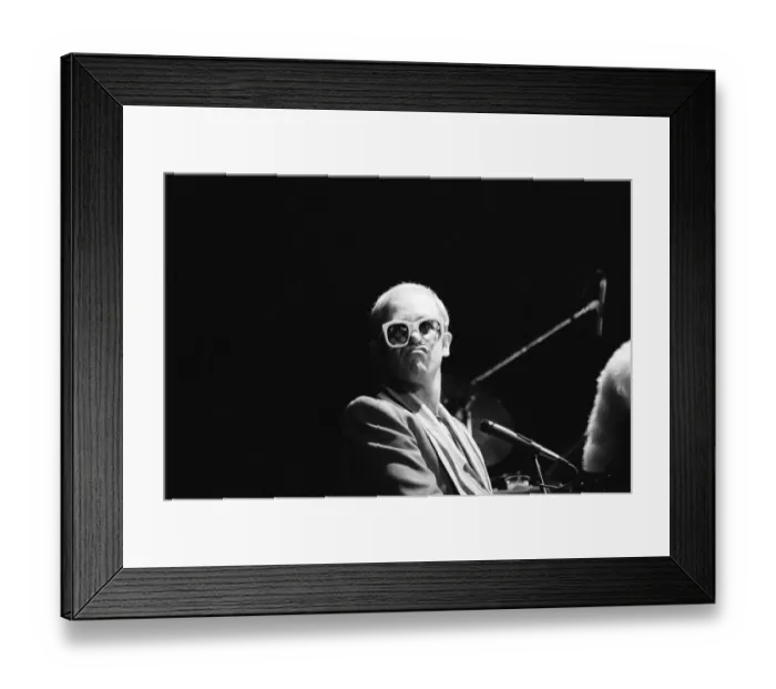 Framed Print : Pop star Elton John on stage at Earls Court, London. This is his first London concert Framed Print : Pop star Elton John on stage at Earls Court, London. This is his first London concert