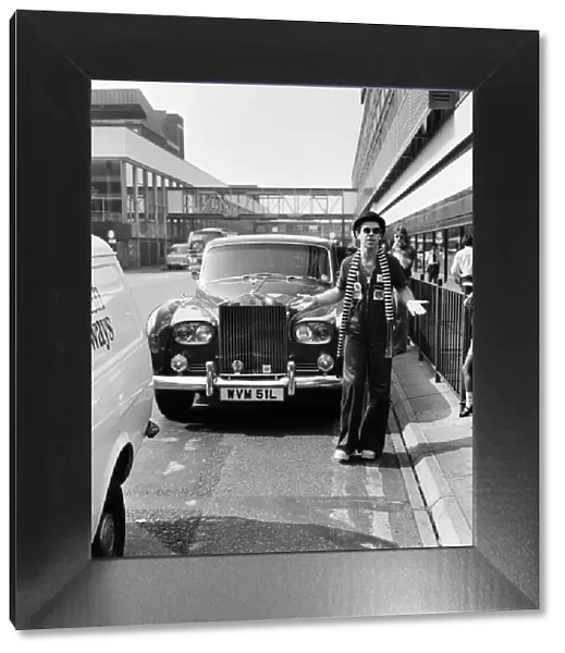 Elton John, pictured with his Rolls Royce. On his arrival from a recording session in Los