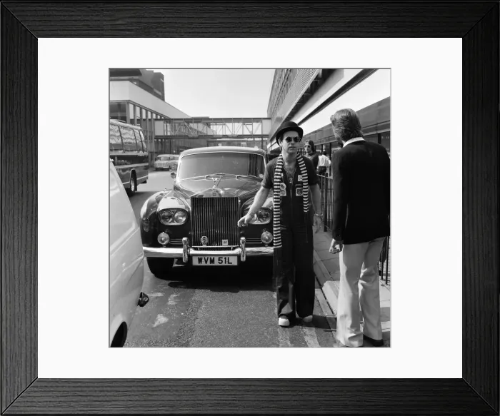 Framed Print : Elton John, pictured with his Rolls Royce. On his arrival from a recording session in Los Framed Print : Elton John, pictured with his Rolls Royce. On his arrival from a recording session in Los