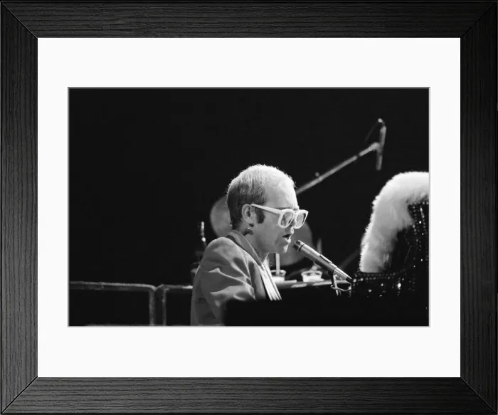 Framed Print : Pop star Elton John on stage at Earls Court, London. This is his first London concert