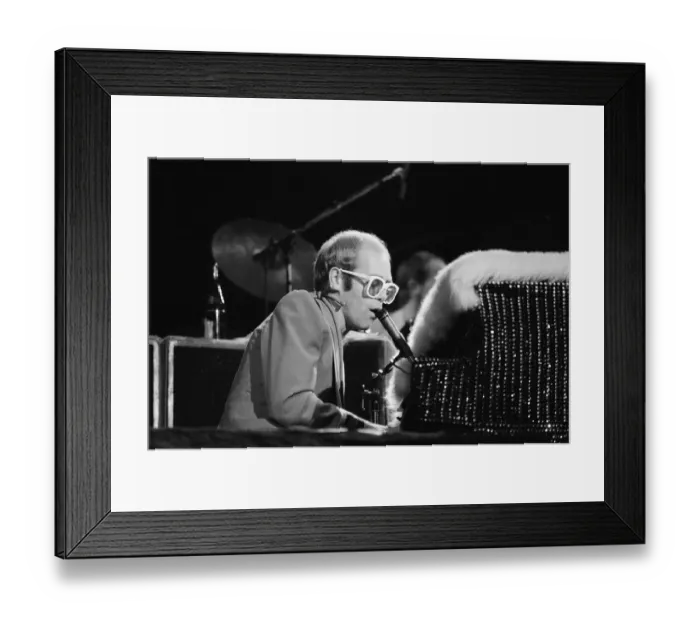 Framed Print : Pop star Elton John on stage at Earls Court, London. This is his first London concert