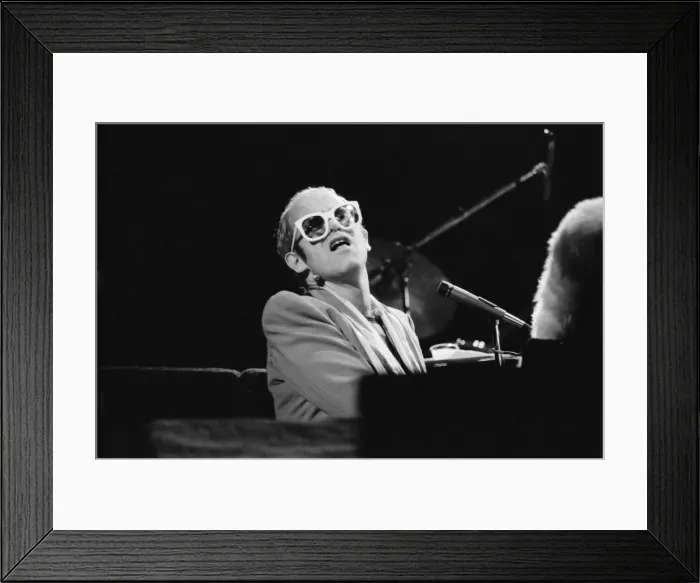 Framed Print : Pop star Elton John on stage at Earls Court, London. This is his first London concert Framed Print : Pop star Elton John on stage at Earls Court, London. This is his first London concert