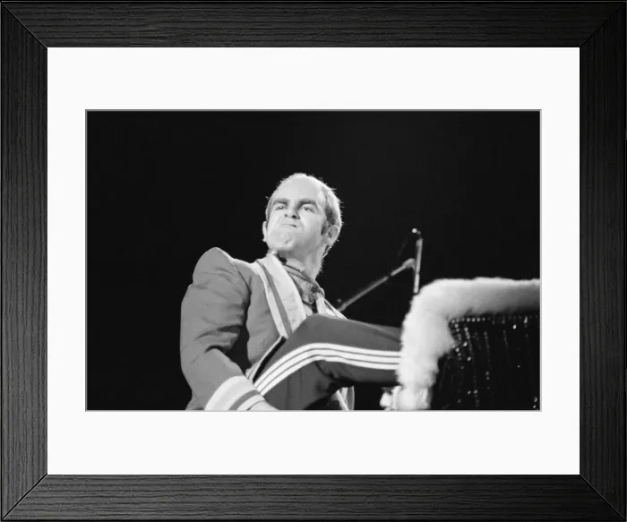 Framed Print : Pop star Elton John on stage at Earls Court, London. This is his first London concert Framed Print : Pop star Elton John on stage at Earls Court, London. This is his first London concert