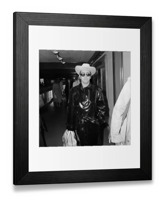 Framed Print : Elton John leaving Heathrow Airport for Los Angeles, where he will be recording a new Framed Print : Elton John leaving Heathrow Airport for Los Angeles, where he will be recording a new