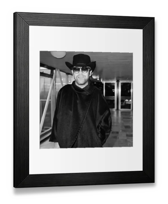 Framed Print : Elton John at Heathrow Airport for a flight to New York. 11th January 1981