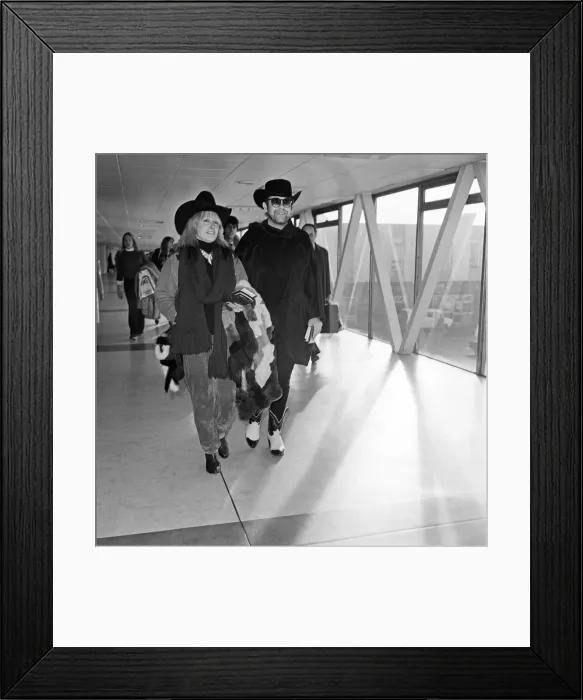 Framed Print : Elton John and Zandra Rhodes at Heathrow. 11th January 1981 Framed Print : Elton John and Zandra Rhodes at Heathrow. 11th January 1981