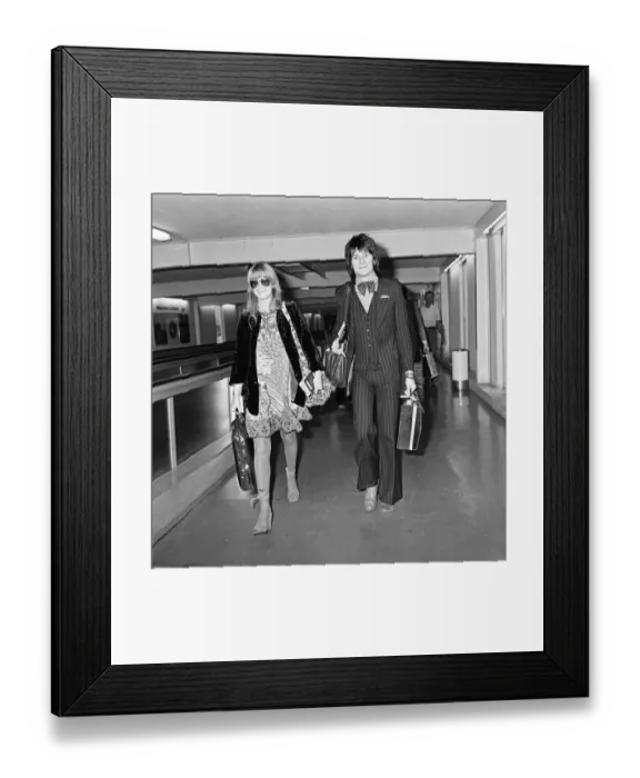 Framed Print : Ronnie Wood and his wife Krissy at Heathrow Airport for a holiday in Nassau Framed Print : Ronnie Wood and his wife Krissy at Heathrow Airport for a holiday in Nassau