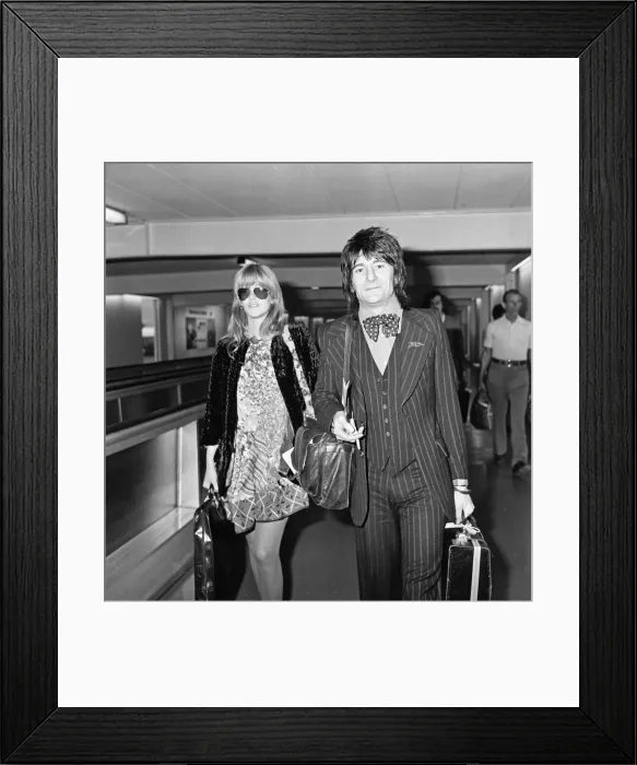 Framed Print : Ronnie Wood and his wife Krissy at Heathrow Airport for a holiday in Nassau