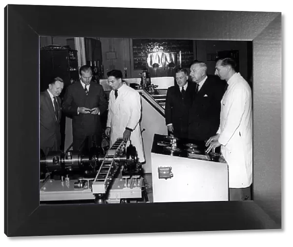 The Duke of Edinburgh inspects a machine for load-testing splines in the laboratory of