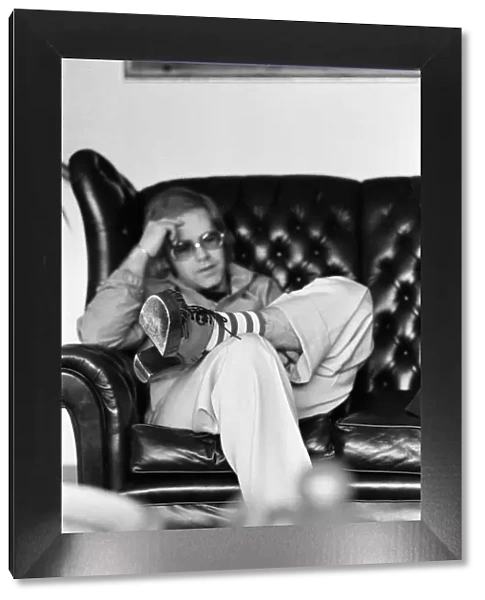 Elton John, singer, pictured at home in Virginia Water. 20th March 1973
