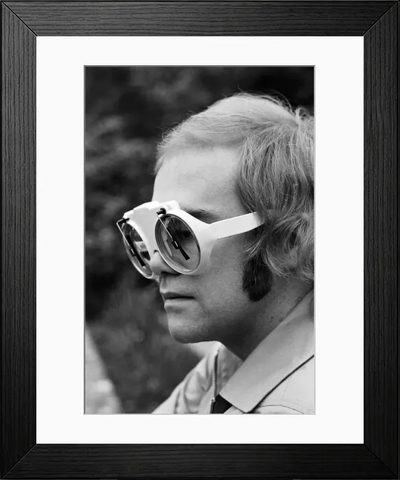 Framed Print : Elton John, singer, pictured at home in Virginia Water. He is wearing glasses which have Framed Print : Elton John, singer, pictured at home in Virginia Water. He is wearing glasses which have