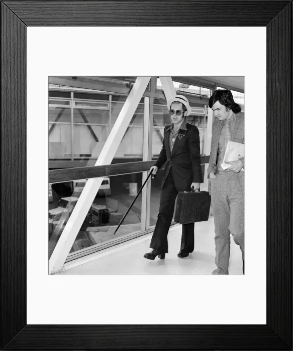 Framed Print : Elton John arrives at Heathrow airport from Arizona where he has been on holiday Framed Print : Elton John arrives at Heathrow airport from Arizona where he has been on holiday