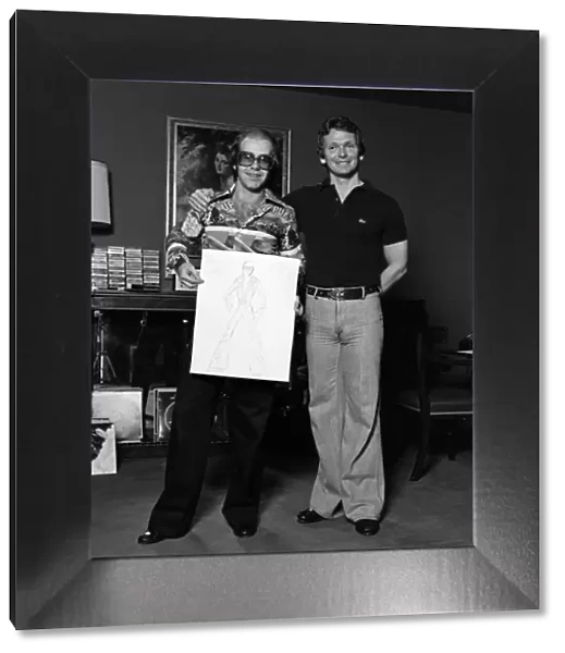 Elton John with designer Bob Mackie. 20th June 1975