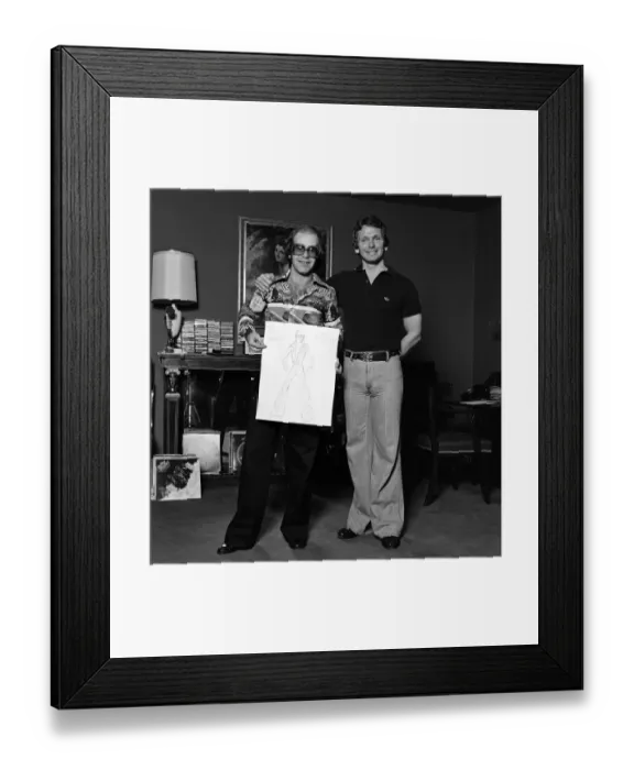 Framed Print : Elton John with designer Bob Mackie. 20th June 1975