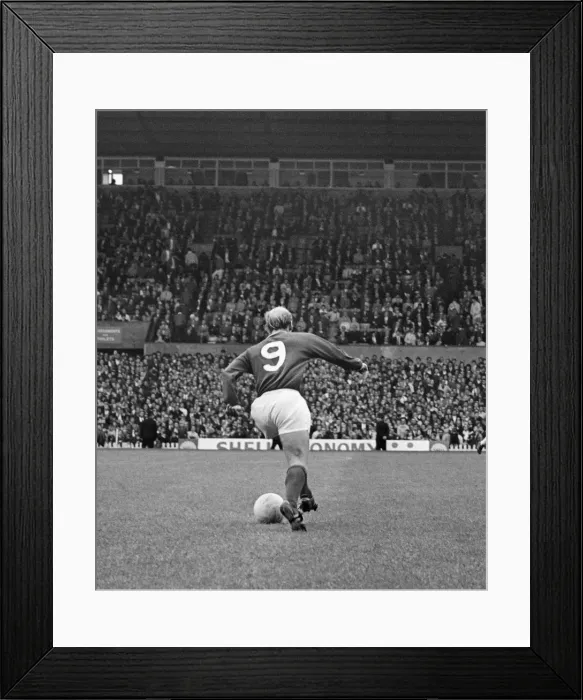 Framed Print : Bobby Charlton, in the number 9 shirt for Manchester United, at Old Trafford
