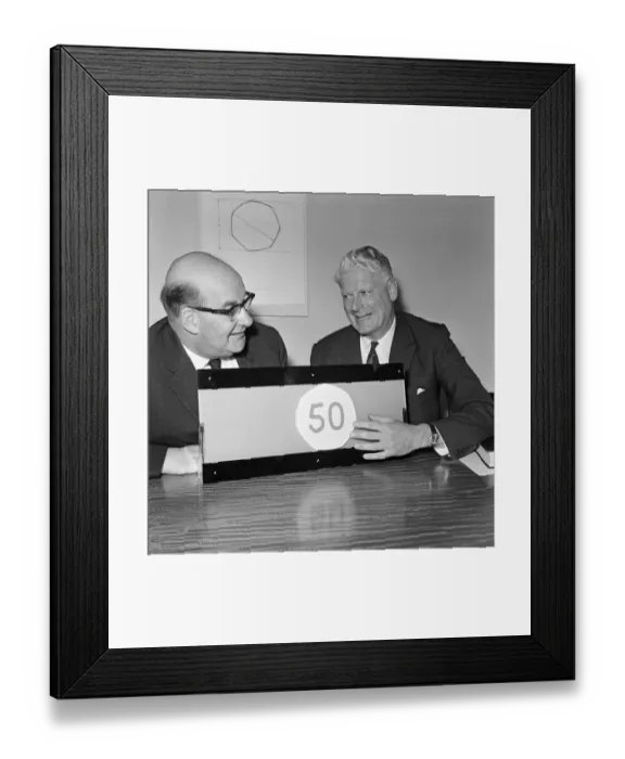 Framed Print : Lord Fiske (left) and Sir Hugh Conway at the unveiling of the new fifty pence piece at a Framed Print : Lord Fiske (left) and Sir Hugh Conway at the unveiling of the new fifty pence piece at a
