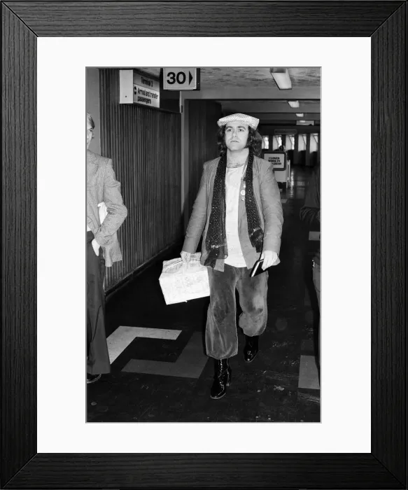 Framed Print : Elton John, pictured at Heathrow Airport, after his eight trail-blazing concerts in Framed Print : Elton John, pictured at Heathrow Airport, after his eight trail-blazing concerts in