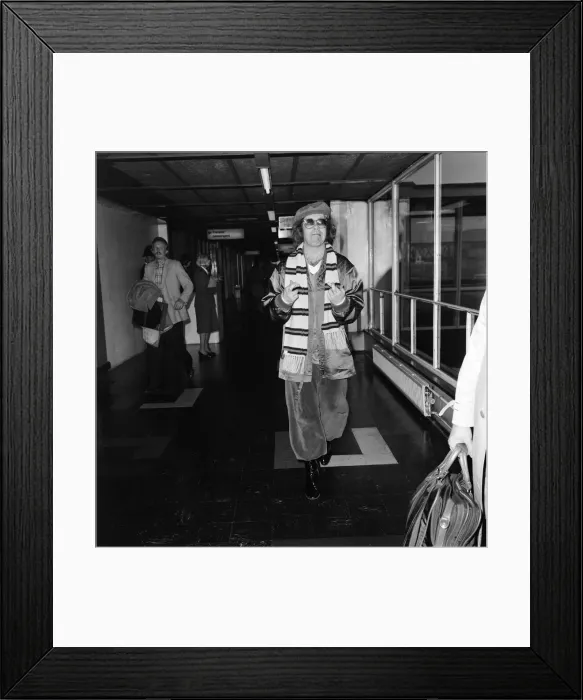 Framed Print : Elton John at Heathrow airport before flying to Moscow for a concert tour. 20th May 1979 Framed Print : Elton John at Heathrow airport before flying to Moscow for a concert tour. 20th May 1979