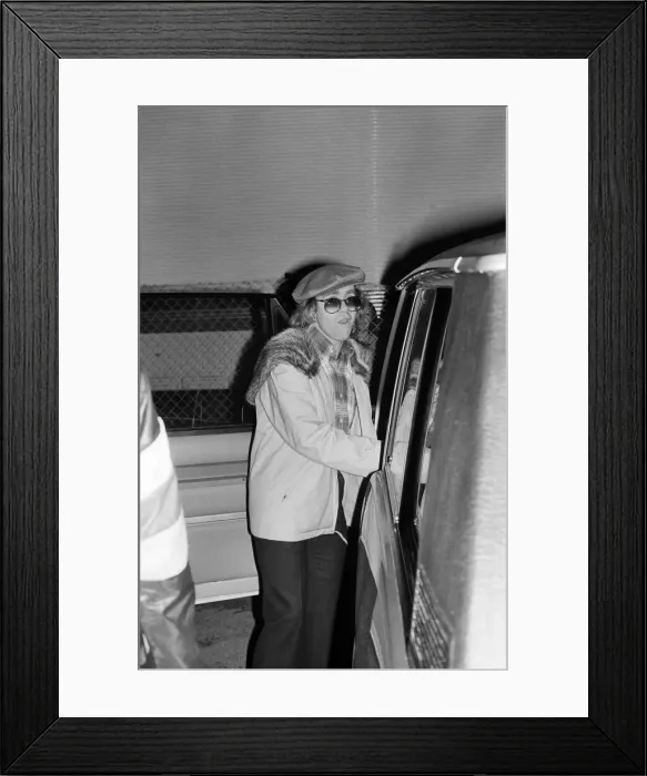 Framed Print : Elton John leaving the Empire Pool Wembley by the back door after he announced his Framed Print : Elton John leaving the Empire Pool Wembley by the back door after he announced his