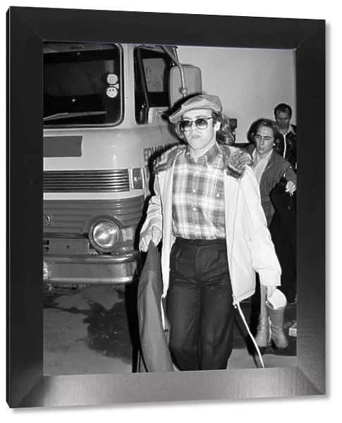 Elton John leaving the Empire Pool Wembley by the back door after he announced his