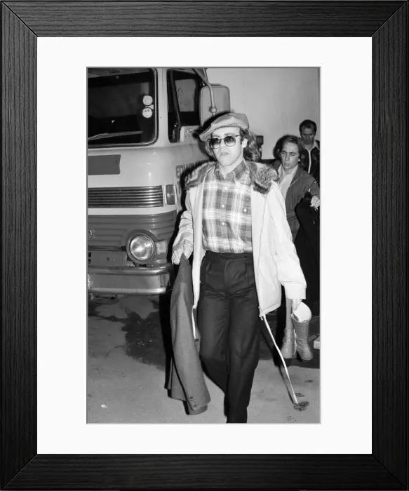 Framed Print : Elton John leaving the Empire Pool Wembley by the back door after he announced his Framed Print : Elton John leaving the Empire Pool Wembley by the back door after he announced his