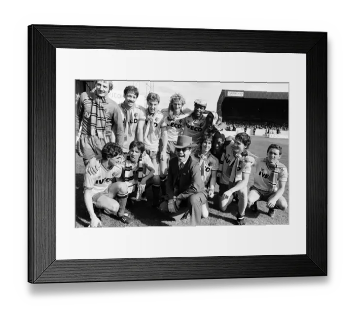 Framed Print : Elton John and the Watford side pose for the photographers after their match against