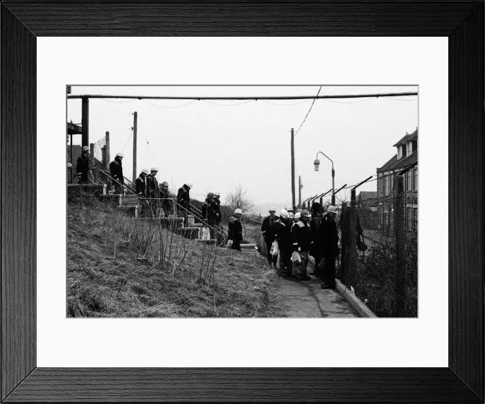 Framed Print : Having changed their clothes, working miners leave the changing room Framed Print : Having changed their clothes, working miners leave the changing room