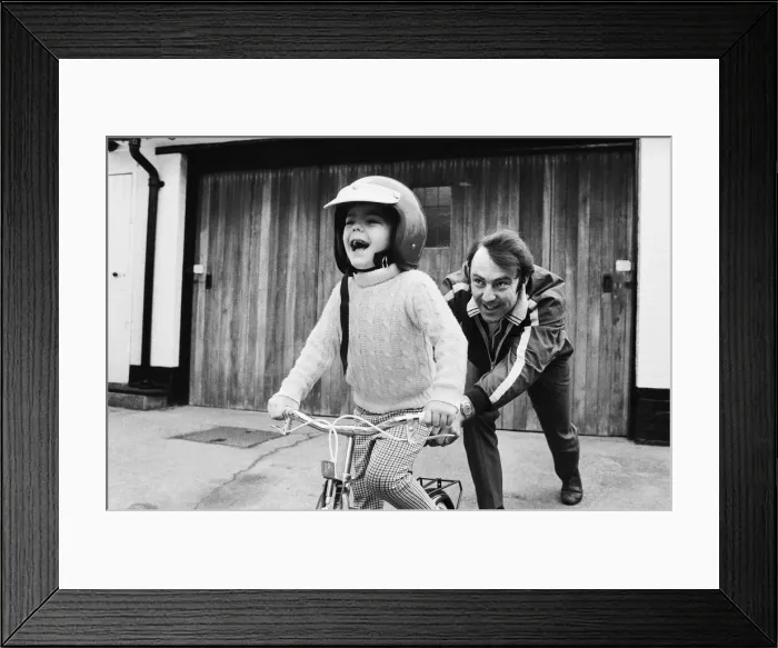 Framed Print : Jimmy Greaves pushing his 4-year old son Andrew, wearing his fathers crash helmet Framed Print : Jimmy Greaves pushing his 4-year old son Andrew, wearing his fathers crash helmet