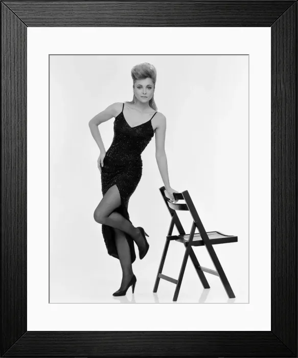 Framed Print : Emma Samms, British actress, studio pix wearing Nolan Miller designed black dress Framed Print : Emma Samms, British actress, studio pix wearing Nolan Miller designed black dress