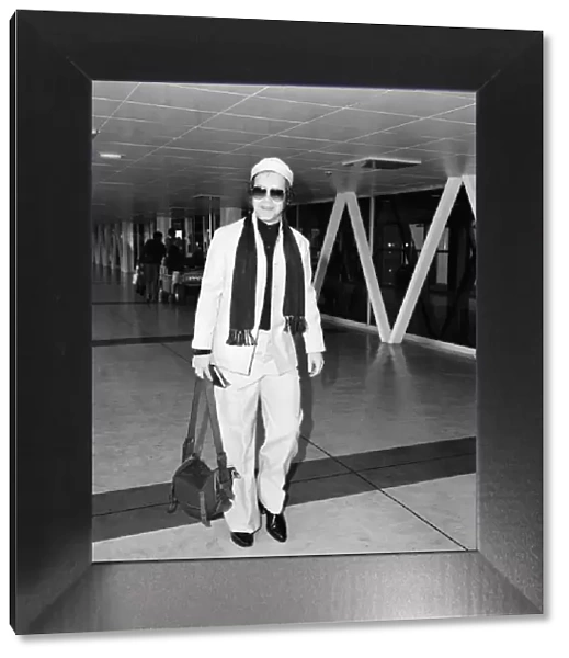 Elton John on his way to New York from Londons Heathrow Airport. 8th October 1978