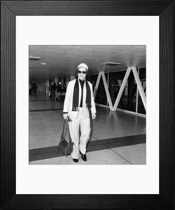 Framed Print : Elton John on his way to New York from Londons Heathrow Airport. 8th October 1978 Framed Print : Elton John on his way to New York from Londons Heathrow Airport. 8th October 1978