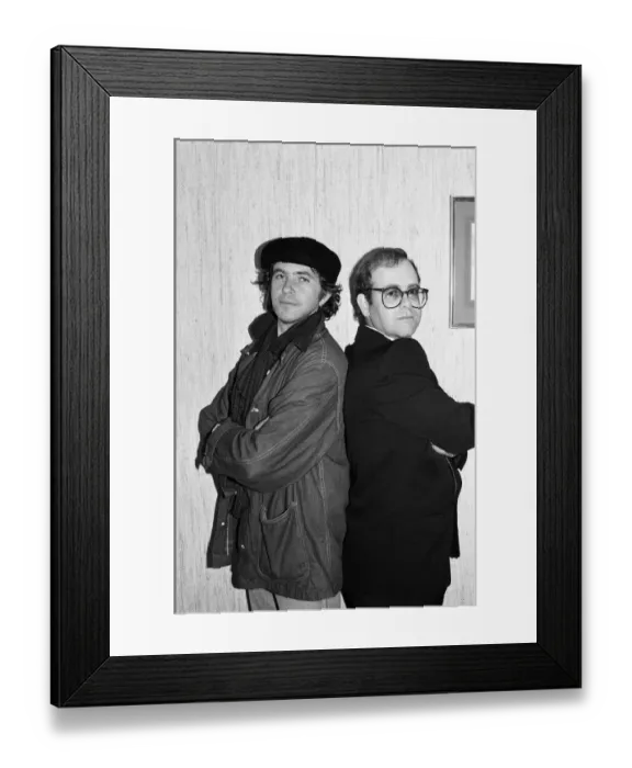 Framed Print : David Essex and Elton John. The two soccer mad fans have just watched their lads do Framed Print : David Essex and Elton John. The two soccer mad fans have just watched their lads do