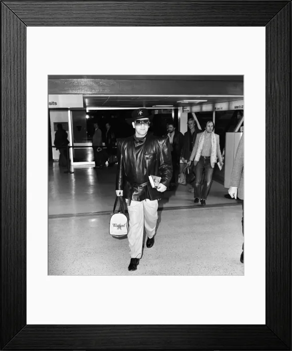 Framed Print : Watford chairman and pop star, Elton John, has good reason to look pleased as he boards a Framed Print : Watford chairman and pop star, Elton John, has good reason to look pleased as he boards a