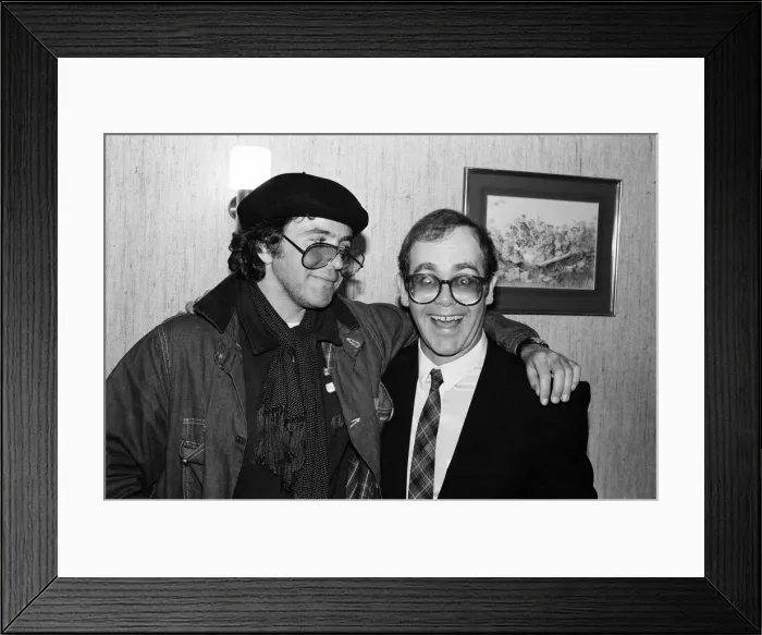 Framed Print : David Essex and Elton John. The two soccer mad fans have just watched their lads do Framed Print : David Essex and Elton John. The two soccer mad fans have just watched their lads do