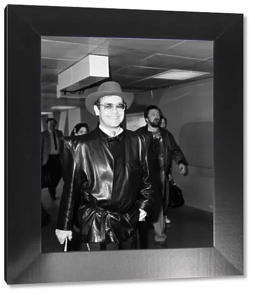 Elton John arriving at Heathrow airport from Copenhagen. 7th May 1982