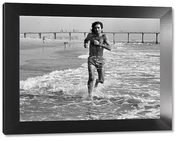 George Best putting in extra training running through the surf and sand at Hermosa Beach