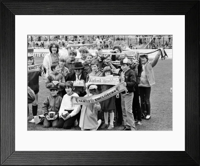 Framed Print : Pop star and Watford FC Chairman, Elton John, handing out Easter eggs to fans Framed Print : Pop star and Watford FC Chairman, Elton John, handing out Easter eggs to fans