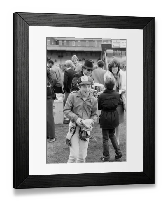Framed Print : Pop star and Watford FC Chairman, Elton John, handing out Easter eggs to fans Framed Print : Pop star and Watford FC Chairman, Elton John, handing out Easter eggs to fans