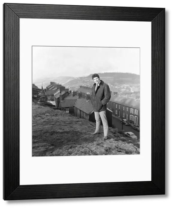 Framed Print : Tom Jones, a boy on top of the world, sings from the mountain top above his hometown of Framed Print : Tom Jones, a boy on top of the world, sings from the mountain top above his hometown of