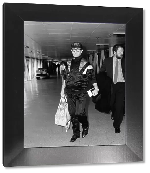 Elton John at Heathrow Airport, London. 19th September 1987