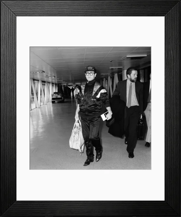 Framed Print : Elton John at Heathrow Airport, London. 19th September 1987 Framed Print : Elton John at Heathrow Airport, London. 19th September 1987