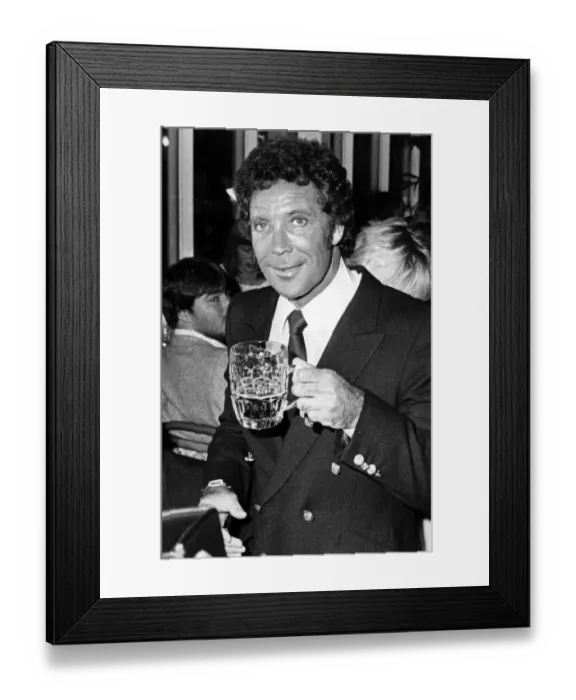 Framed Print : Tom Jones enjoys a pint at the Celtic Manor Hotel, Newport. 11th September 1983 Framed Print : Tom Jones enjoys a pint at the Celtic Manor Hotel, Newport. 11th September 1983