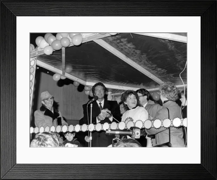 Framed Print : Tom Jones turns on the Christmas lights in his hometown of Pontypridd, Wales