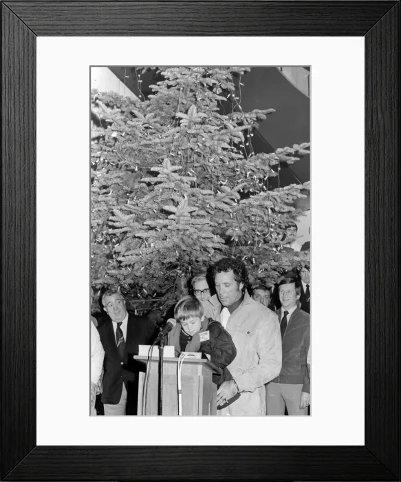 Framed Print : Singer Tom Jones, assisted by his grandson Alexander Woodward