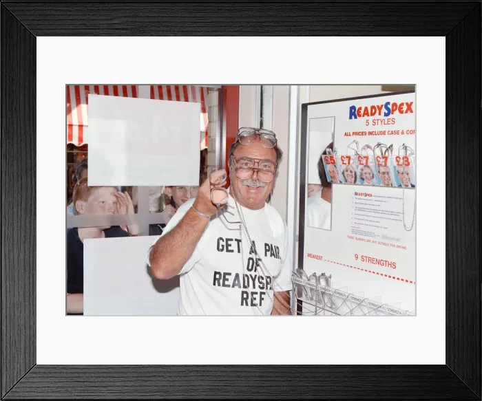 Framed Print : Ex footballer Jimmy Greaves at the worlds first spectacle vending machine Framed Print : Ex footballer Jimmy Greaves at the worlds first spectacle vending machine