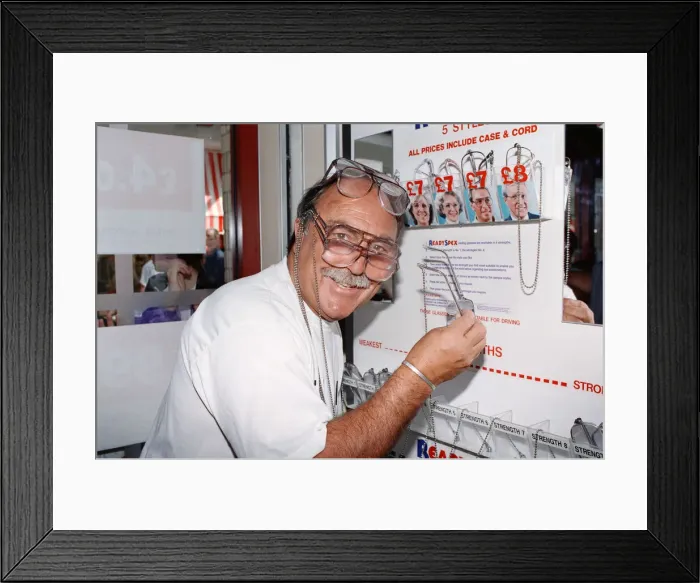 Framed Print : Ex footballer Jimmy Greaves at the worlds first spectacle vending machine Framed Print : Ex footballer Jimmy Greaves at the worlds first spectacle vending machine