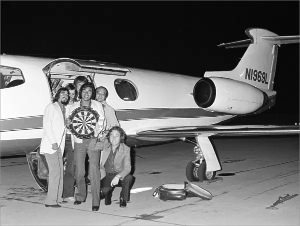 Engelbert Humperdinck arrives by private jet for a darts match. 25th July 1973