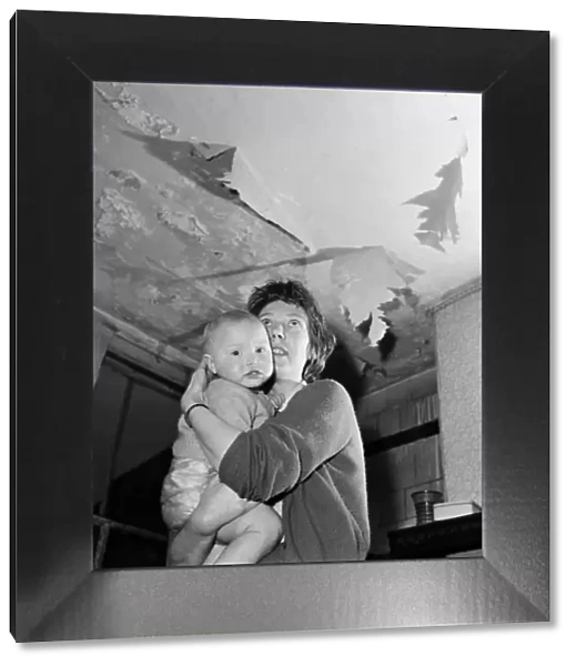 Slum housing in Salford. Mrs Moore and her 1 year old son Peter