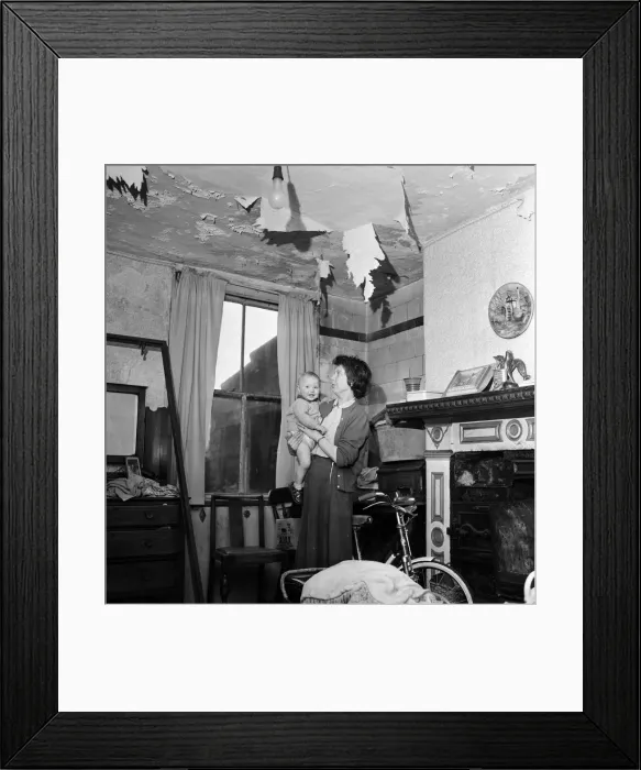 Framed Print : Slum housing in Salford. Mrs Moore and her 1 year old son Peter Framed Print : Slum housing in Salford. Mrs Moore and her 1 year old son Peter