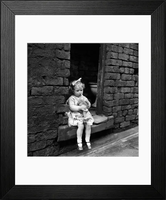 Framed Print : Slum housing in Everton, Liverpool. Diane McCardle is two and a half years old Framed Print : Slum housing in Everton, Liverpool. Diane McCardle is two and a half years old